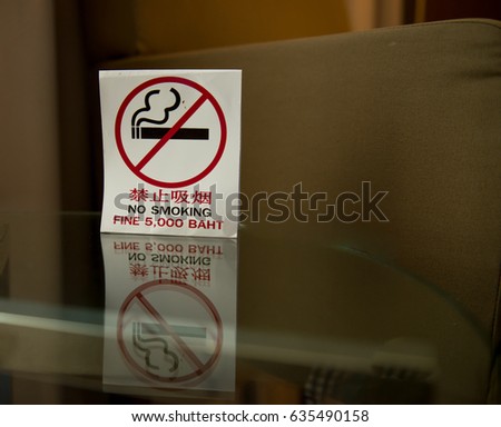 Smoking Ban,No smoking area labels,Smoking Prohibited ,Signs that no cigarettes are placed on the glass table in the bedroom,Desktop badge of no smoking in this area.