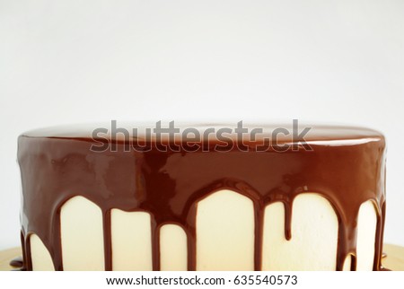 Cake with chocolate mirror glaze. Close-up. Picture for a menu or a confectionery catalog.