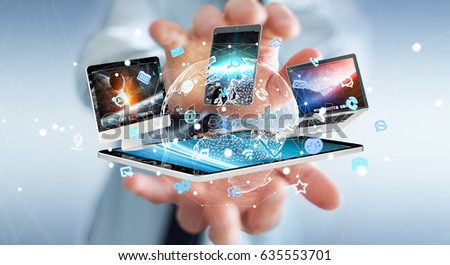 Businessman on blurred background connecting tech devices 3D rendering