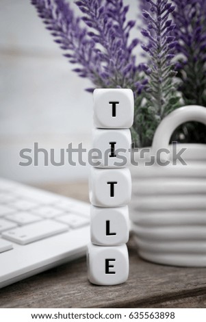 Vertical letter dices with title text