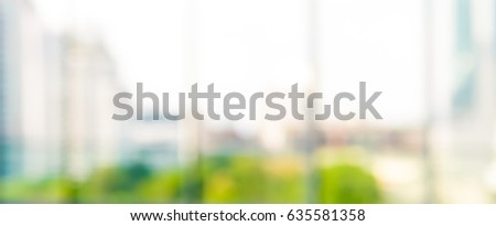 Blur city building view looking through glass window,  abstract panoramic banner background
