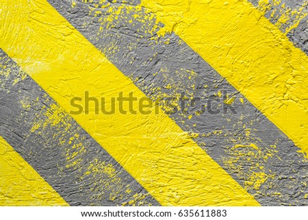 Background, yellow-gray warning stripes. Warning of danger