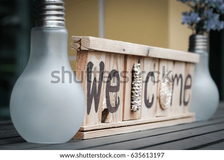 Welcome sign Put on a wooden table