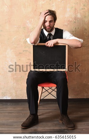 student or tired businessman holding a blackboard, copy space