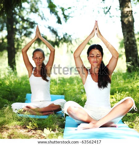 yoga woman on green grass