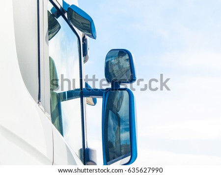 Some mirrors on the door of a truck Royalty-Free Stock Photo #635627990