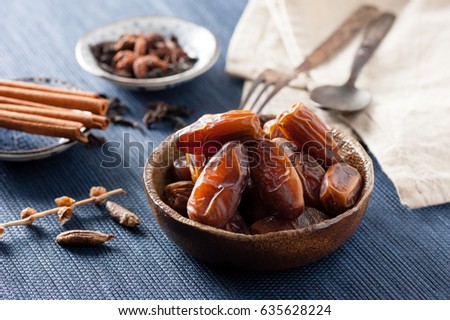 closeup sweet dried date palm fruits or kurma, ramadan (ramazan) food Royalty-Free Stock Photo #635628224