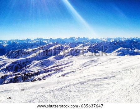 Panorama view of a snowy mountain landscape in the sunlight, Damuls Vorarlberg Austria