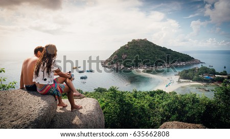 Happy Romantic Couple Enjoying at viewpoint on island,Travel Vacation Lifestyle summer Concept.Tropical paradise on the island of Koh nang yuan in Thailand,vintage tone  Royalty-Free Stock Photo #635662808