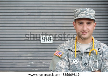 Friendly young military doctor in uniform