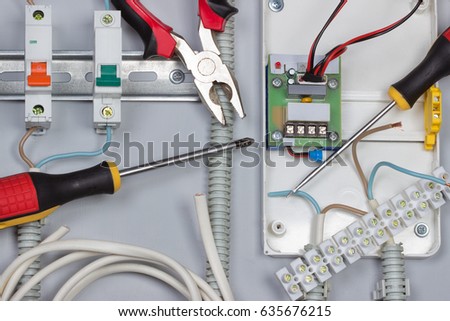  Installation of electrical devices, wires in distribution board Royalty-Free Stock Photo #635676215