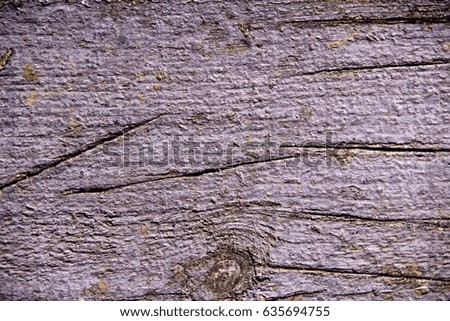 Texture of an old wooden table with paint, scratches and knots.