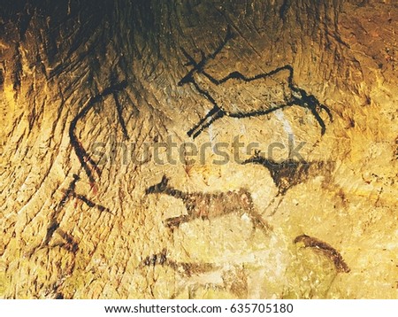 Paint of human hunting of deers, mammoth and reindeer. Historical black carbon abstract art in sandstone cave in poor light. Discovery of prehistoric paint of caveman hunt in sandstone cave. 
