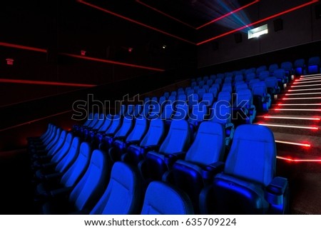 Cinema hall, movie theater, theatre with blue armchairs and copy space