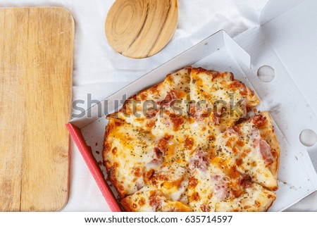 Hawaiian pizza in a box