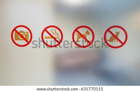 Prohibition signs on the glass and background