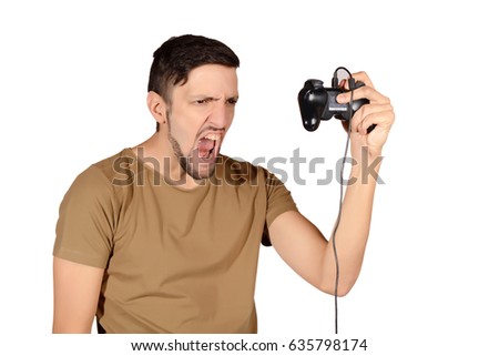 Portrait of young man playing videogames. Isolated white background.