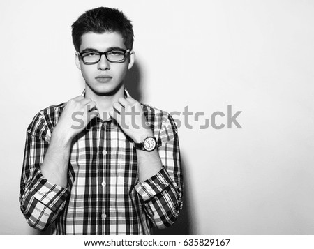 young man with glasses and watch