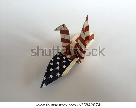 Paper bird and space for text on white background,American flag patterned