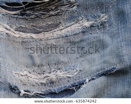 Denim jeans texture, Denim jeans background with old torn of jeans fashion design. Dark edged.