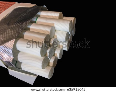Unpacked carton or box with full of cigarettes. No tobacco day concept. Black background picture.