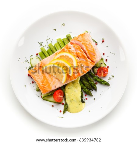 Grilled salmon with asparagus in béchamel sauce Royalty-Free Stock Photo #635934782