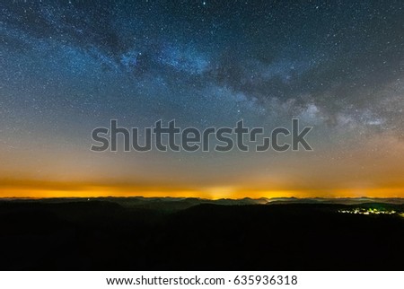 Astro Landscape with the Milky Way as seen from the Luitpold Tower in the Palatinate Forest in Germany.