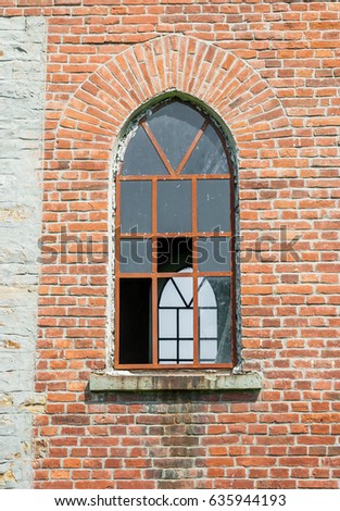 Old broken window in the abandoned church