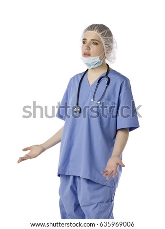 Female doctor or nurse wearing surgical scrubs and a mask isolated on white