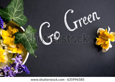 Go Green, used by green leafs on Black flowers background