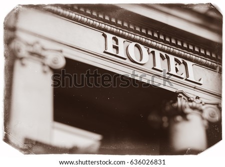 Hotel word with majestic letters on luxury five star hotel with beautiful columns - vintage photo