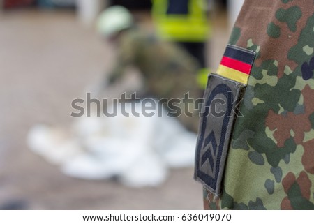 the german fire fighter and the german army have a exercise with a dummy Royalty-Free Stock Photo #636049070