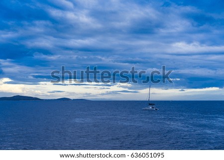 Adriatic Sea Croatia Europe. Beautiful nature and landscape photo of ocean and cloudy sky at spring dusk evening. Nice outdoors image with lovely blue color tones. Calm and peaceful picture.