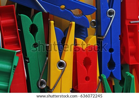
Colorful forecaps tweezers clips as background.