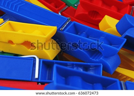 
Colorful foracaps tweezers clips as background.