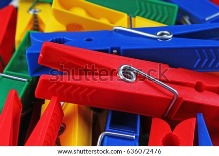 
Colorful foracaps tweezers clips as background.