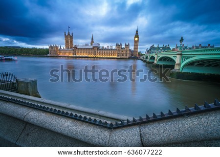 View of the Houses of Parliament and Westminster Bridge in London at dusk with vignette and 