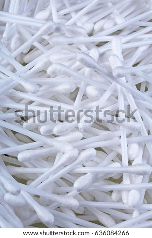 Cotton swabs ear cleaning or cosmetic tool as background texture pattern.