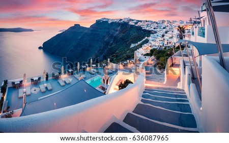 Great evening view of Santorini island. Picturesque spring sunset on the famous Greek resort Fira, Greece, Europe. Traveling concept background. Artistic style post processed photo.