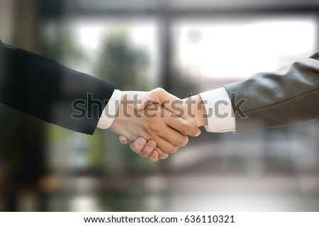 M&A (MERGERS AND ACQUISITIONS) , Businessman handshake working at office M&A Royalty-Free Stock Photo #636110321