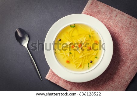 Homemade chicken soup with noodles, top view