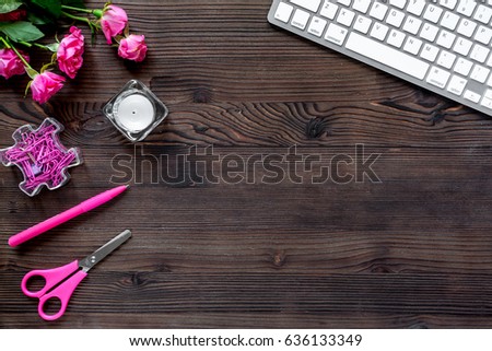 woman working place with flowers and keboard on wooden background top view mockup