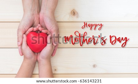 Happy Mother's day and love you Mom holiday greeting card with  woman support kid's hands giving red heart gift  Royalty-Free Stock Photo #636143231