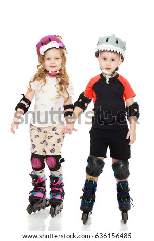 Little boy and girl skating in helmets and knee pads.Isolated on white background.