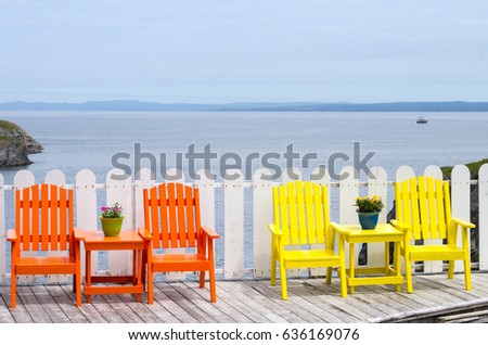 Colorful Chairs on Deck By Ocean