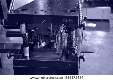 Sheet Metal Stamping Tool Die for Automotive Precision Parts on The Numerical Control Milling Machine Table. Tandem Stamping System. At a High Quality Technology Factory. Cyanotype Photography.