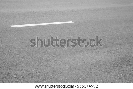 Asphalt background texture with some fine grain with road.