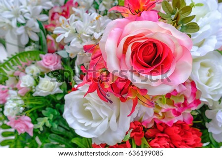 Closeup beautiful valentine red and white rose artificial flowers for background.
