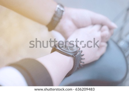 blurred picture of Young couple in love holding hands 