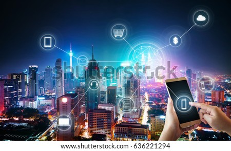 Unknown woman using smartphone with cityscape and network mobile payments, online shopping concept background .